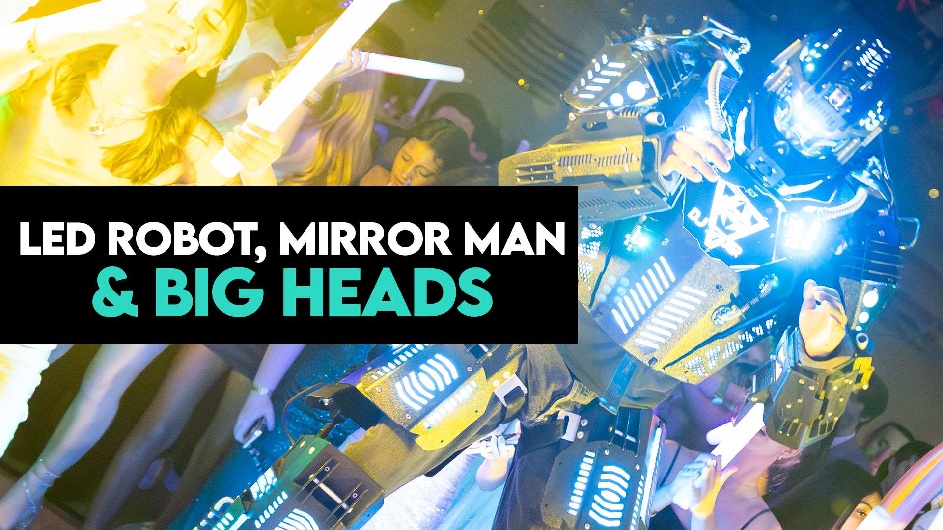 LED robot dancer on stilts with glowing lights performing beside a mirror man and a giant Bad Bunny big head character at an event