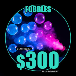 Fog-filled bubbles floating through colorful event lighting from a Fobbles machine on a dance floor