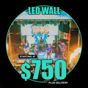 Festival stage with LED pillars and backdrop displaying animations